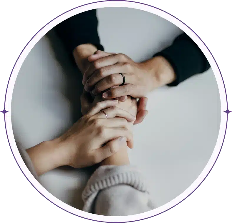 Three hands stacked in support.