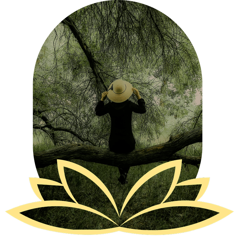Woman in white shirt doing tree pose with misty mountains.