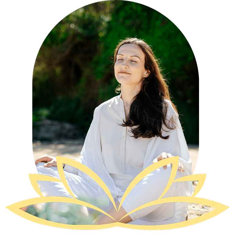 Woman in white shirt doing tree pose with misty mountains.
