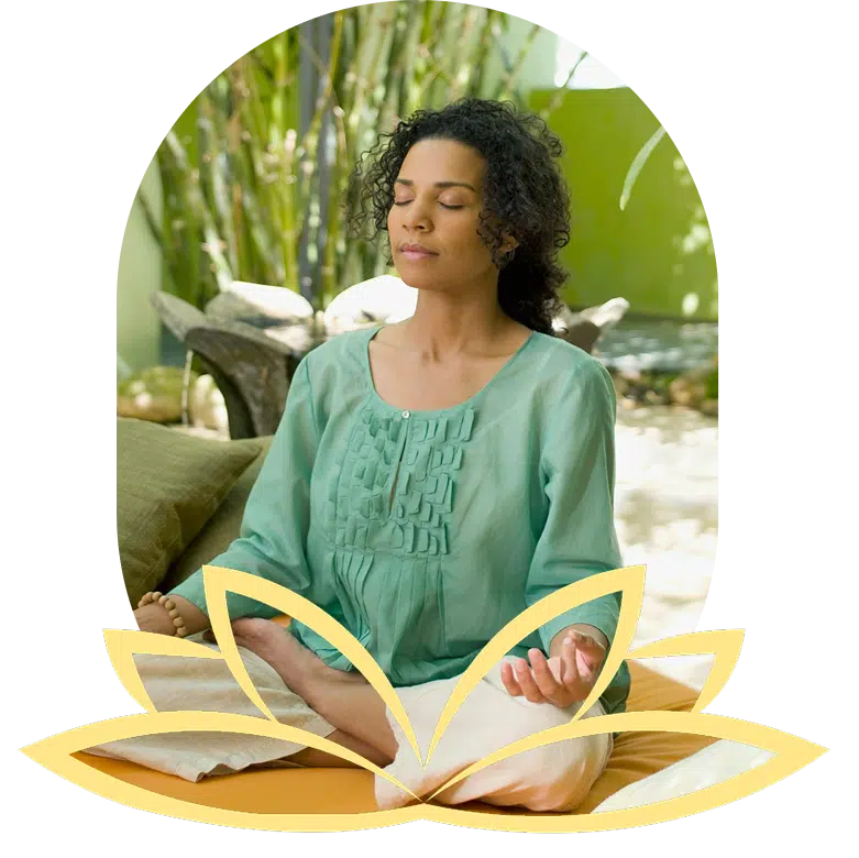 Woman in white shirt doing tree pose with misty mountains.